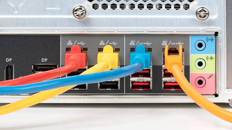Four network cables connected to four individual ports